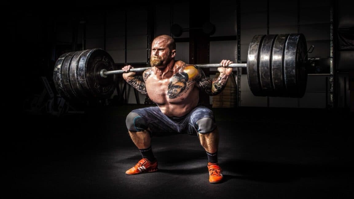 Exploring the Physics Behind Olympic Weightlifters' Use of Barbell Whip
