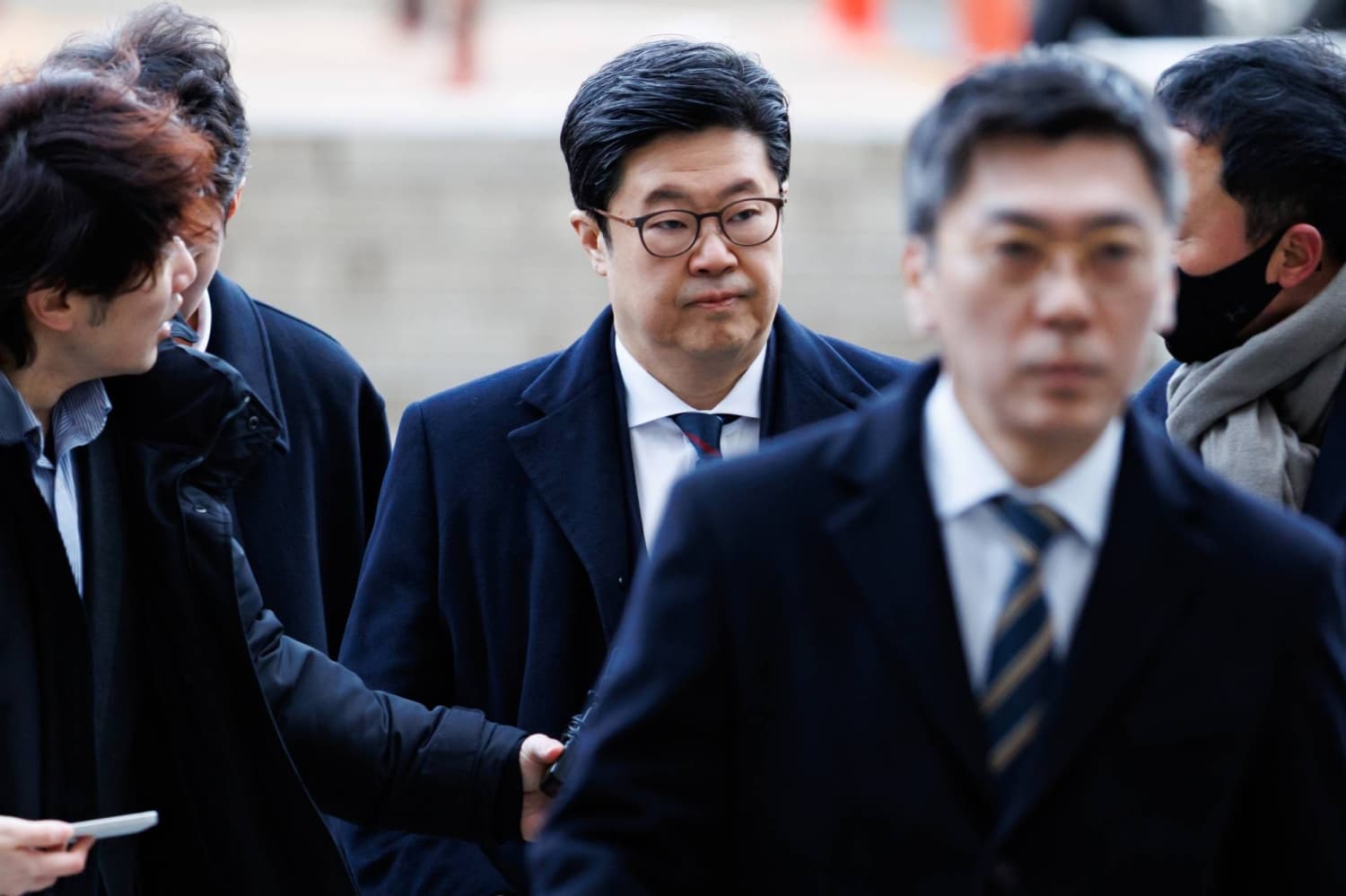 Buyout billionaire Kim wins court fight over arrest bid