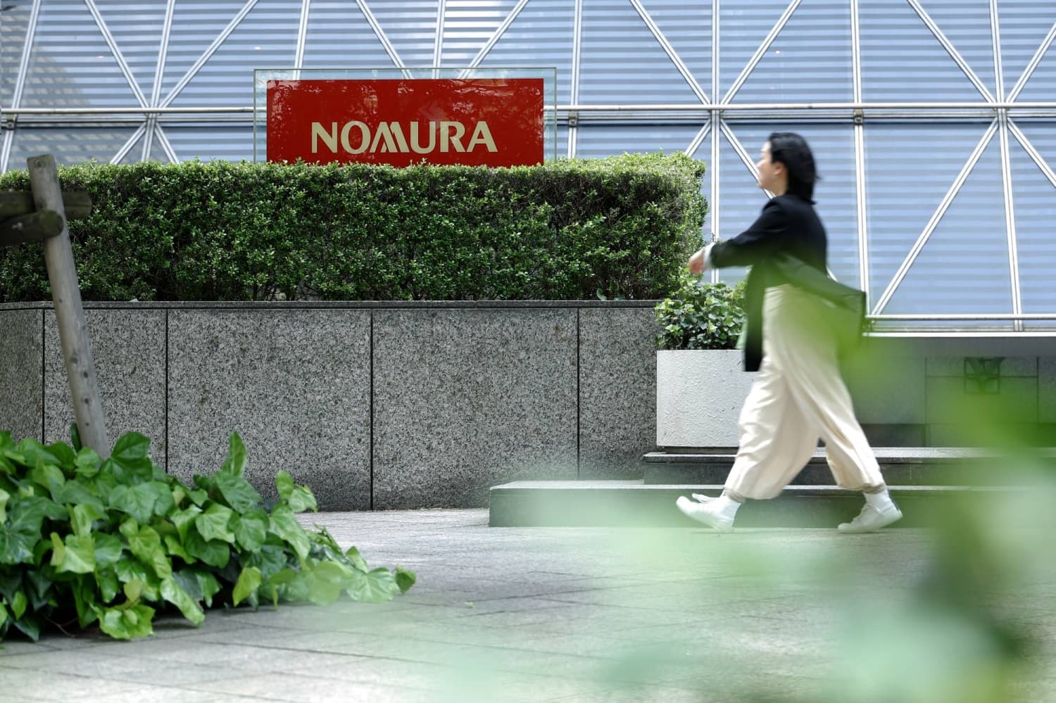 Nomura stock hit after research affiliate writedown, Europe loss