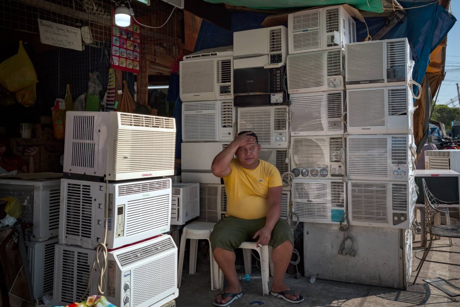 Southeast Asia office workers swelter in energy-saving drive amid heat wave