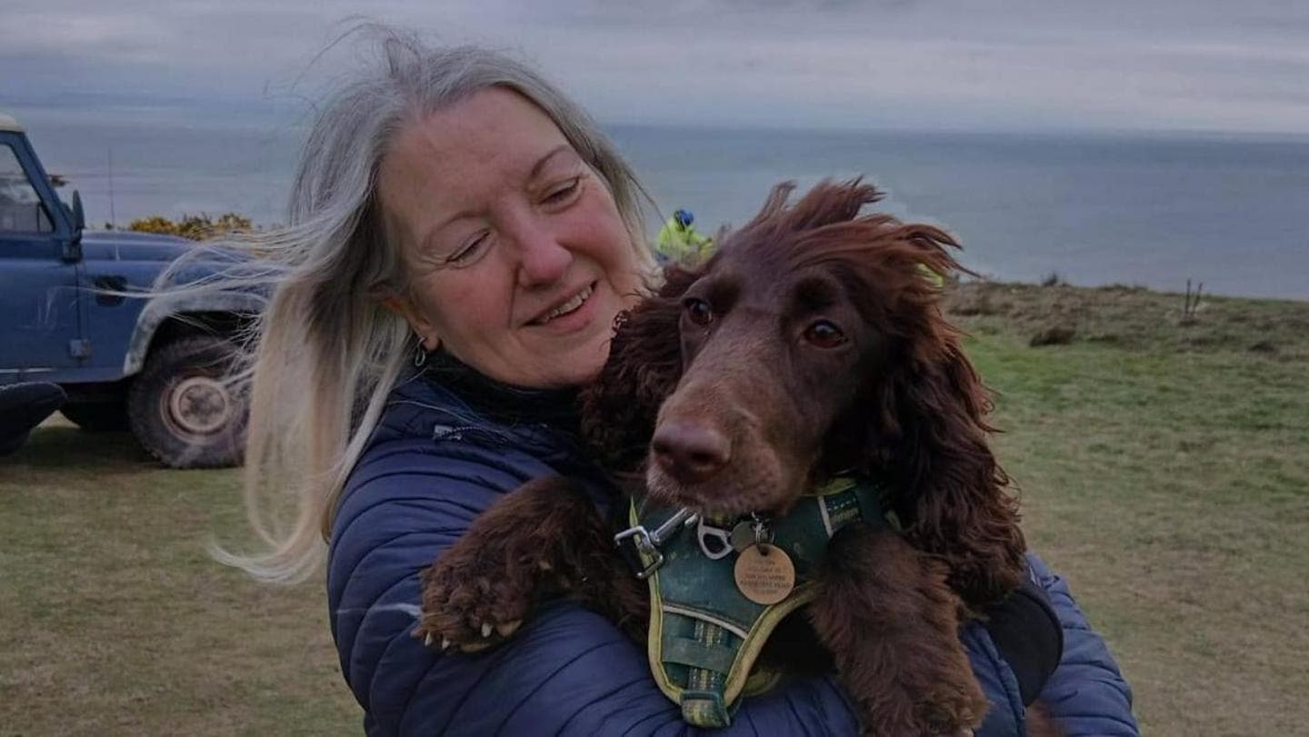 Coastguards lower dog owner down cliff to rescue pet