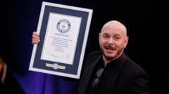 Pitbull Fans Achieve Guinness World Record for Largest Bald Cap Gathering