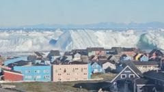 Video captures giant iceberg flipping over off the coast of Greenland