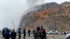 Moroccan Police Engage with Migrants Near Spain's Ceuta Border