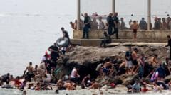 Hundreds of migrants arrive in Ceuta from Morocco, straining local resources