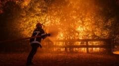 Macron Holds Crisis Meeting as Wildfires Approach Bordeaux Amid Heatwave