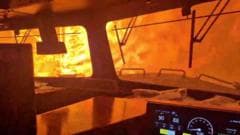 Video captures freight train surrounded by wildfire in Canada