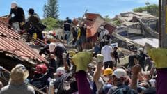 Colombian Brother Searches for Earthquake Survivors Amidst Building Rubble