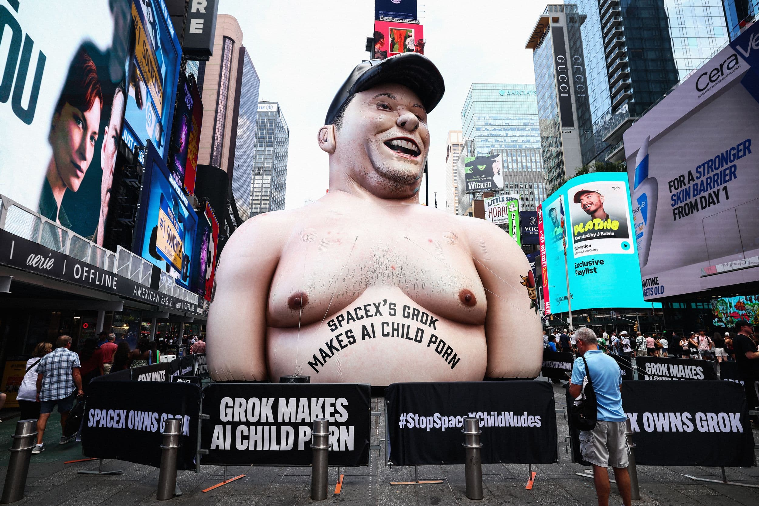 Activists Unveil 40-Foot Inflatable Elon Musk in Times Square Protest