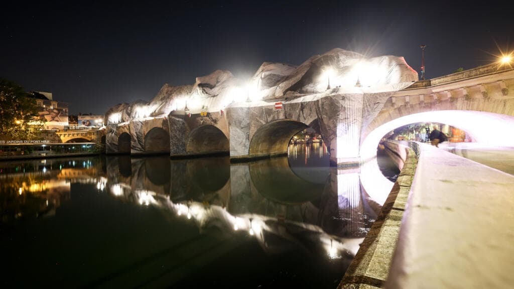 Artist JR Begins Inflating Cave Installation Around Paris's Pont Neuf Bridge