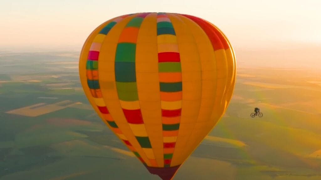 Austrian Mountain Biker Makes History by Riding Off Hot Air Balloon