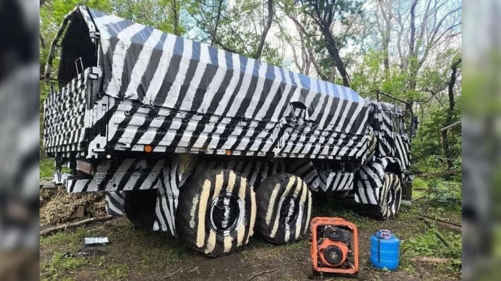 Russian Trucks in Ukraine Utilize Zebra Camouflage to Evade Drone Detection