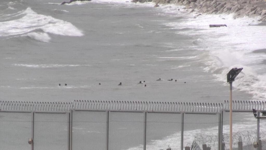 Hundreds of migrants cross from Morocco into Spain's Ceuta territory
