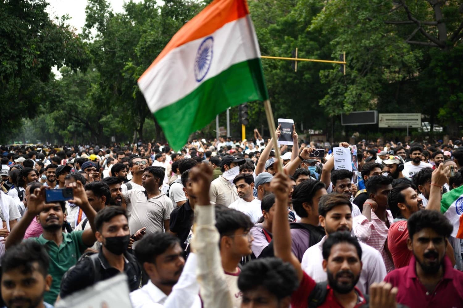 Supporters of India's cockroach movement march despite police restrictions